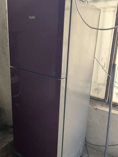 Mid sized fridge for sale,dark red color,no scratches