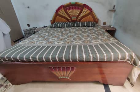 Double bed with spring mattress