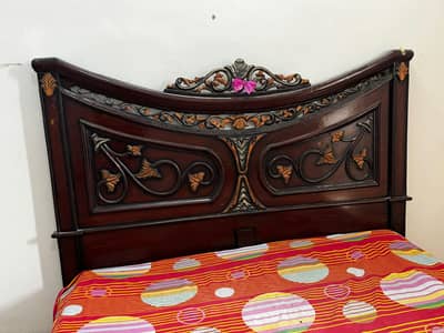 one single bed without mattress and one double bed with mattress