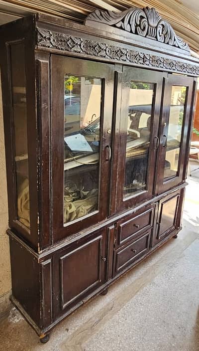 Heavy wooden cabinet with three doors