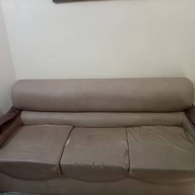 7 seater leather sofa set with a glass table.