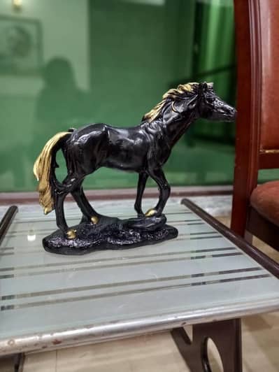 Black and gold decorative horse sculpture
