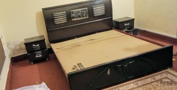 Bed with side tables and dressing table