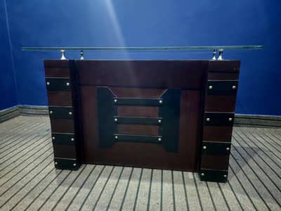 WOODEN OFFICE TABLE WITH GLASS TOP. 48×26 inches .  TWO DRAWERS