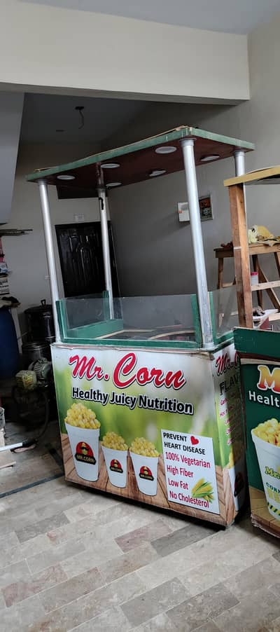 fries and sweet corn food stall cart