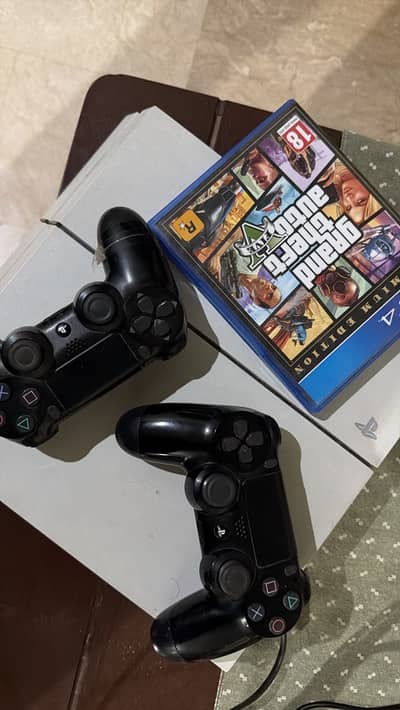 PlayStation 4 500gb with Free GTA 5 and 2 Controllers
