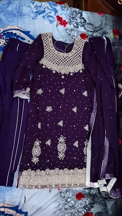 Embroidered formal article