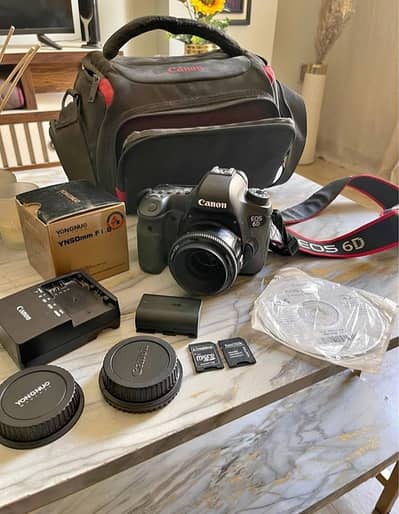Canon EOS 6D with 50mm lens with all these accessories