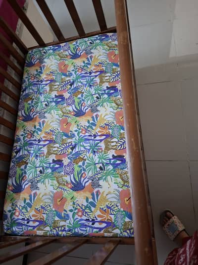 Cot for sale with mattress.
