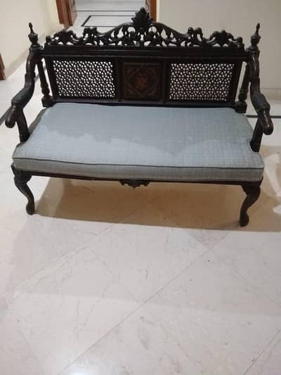 Two seater wooden sofa