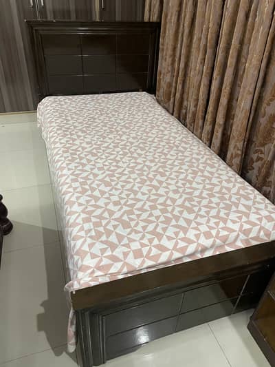 Wooden single bed