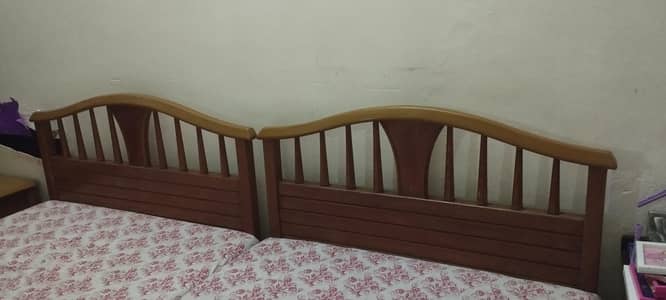 single beds with mattress and side table