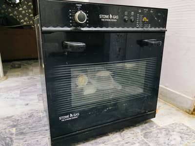gas oven with light and timer and temperature meter with it