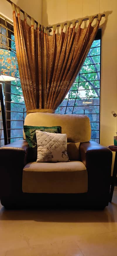 Beige and chocolate brown sofa set.