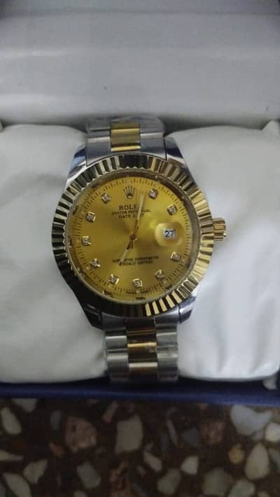 Rolex watch with date  gold colour gold addition water resistant