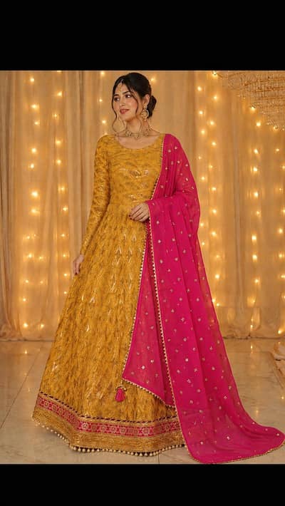Beautiful lehnga choli in mustard yellow colour and a hot pink duppta