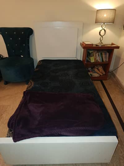 Two wooden single beds