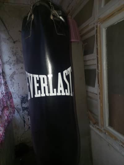 Heavy Everlast punching bag with punching gloves and hand wraps
