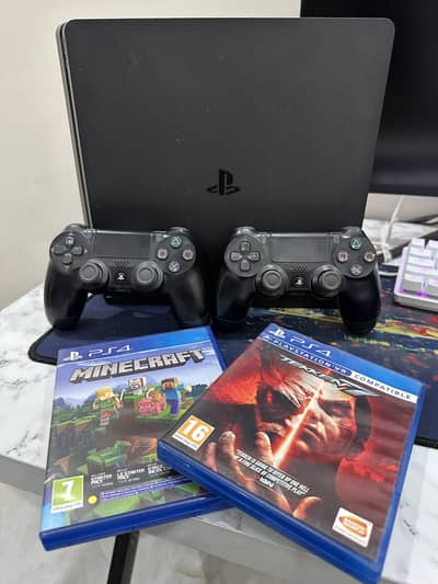 PS4 Slim + 2 controllers + 2 Games( Tekken 7 and Minecraft)