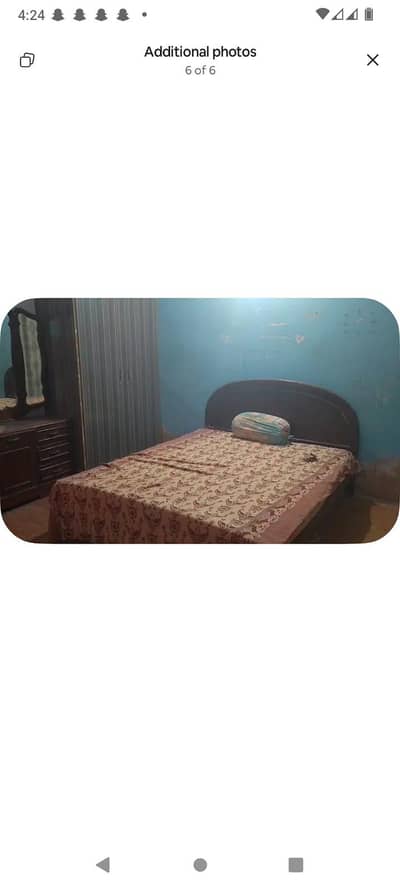 Wooden double bed without mattress