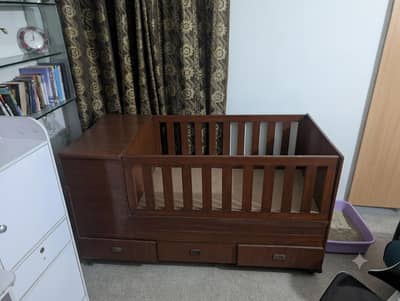 baby cot with draws and racks