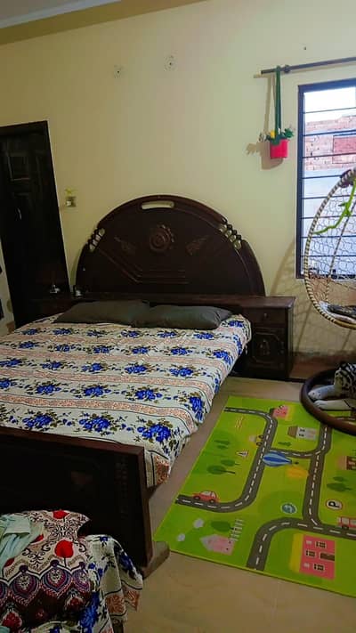 wooden bed with side tables