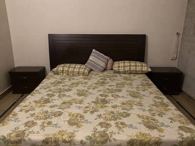 Wooden bed with bedside tables for sale
