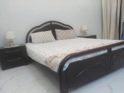 Wooden bed with side tables for sale