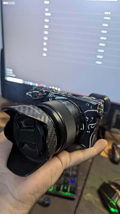 Sony A6500 with 50mm f1.8 lens, Battery and Charger and gorilla skin