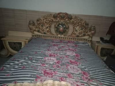 one bed and dressing with two side tables without matters