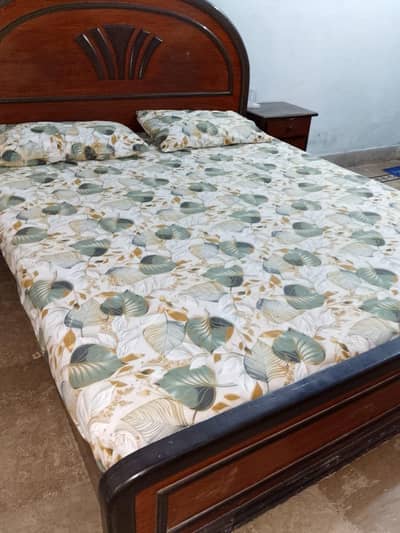 bed with side table with mattress