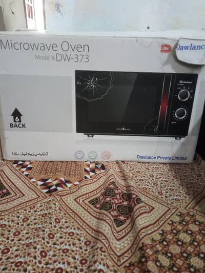 Dawlance microwave oven slightly used with box urgent sale