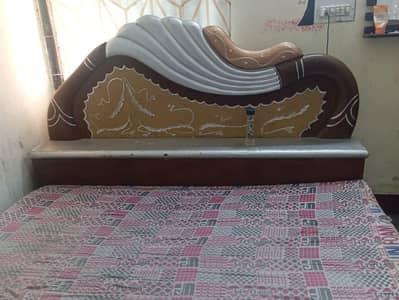 heavy wooden double bed