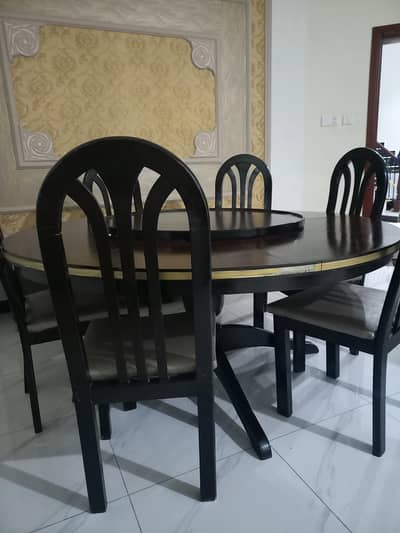 Black teakwood dinning table with chairs