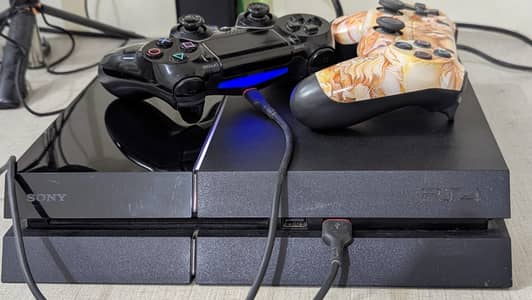 PS4 Console with Two Controllers + 3 games