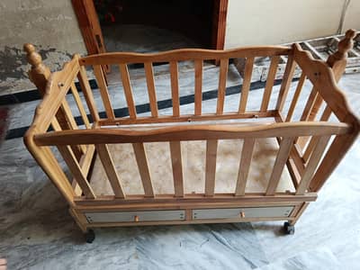 wooden baby cot with wheels and inbuilt boxes