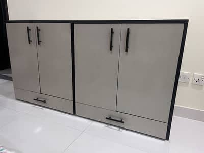 Lasani storage piece with Formica finishing in light grey color.