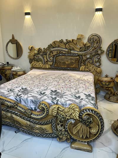 Pure wooden bed with dressing table, diwan , side tables and a chair.