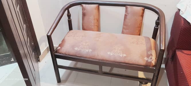 wooden sofa with two chairs