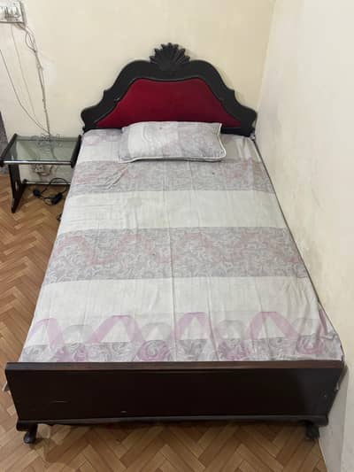 Selling a vintage solid wood bed with mattress.