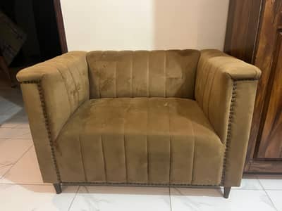 its a two seater luxurious looking sofa very slightly used