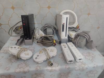 2 Nintendo Wii Consoles with other accessories