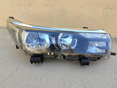 Toyota Corolla right side head light and front grill