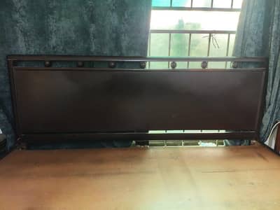 Wooden bed available with mattress for sale in good condition