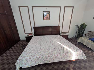wooden bed with side tables