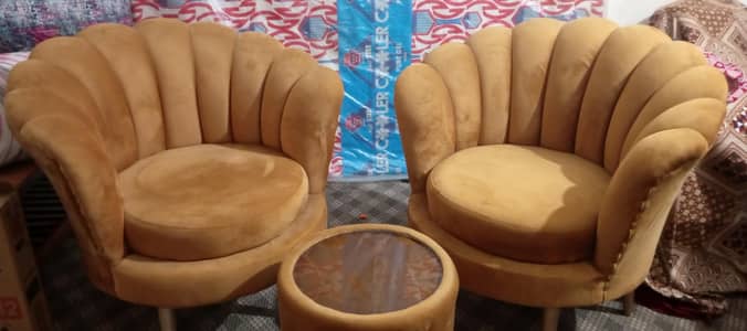 2 sofa chairs with round table
