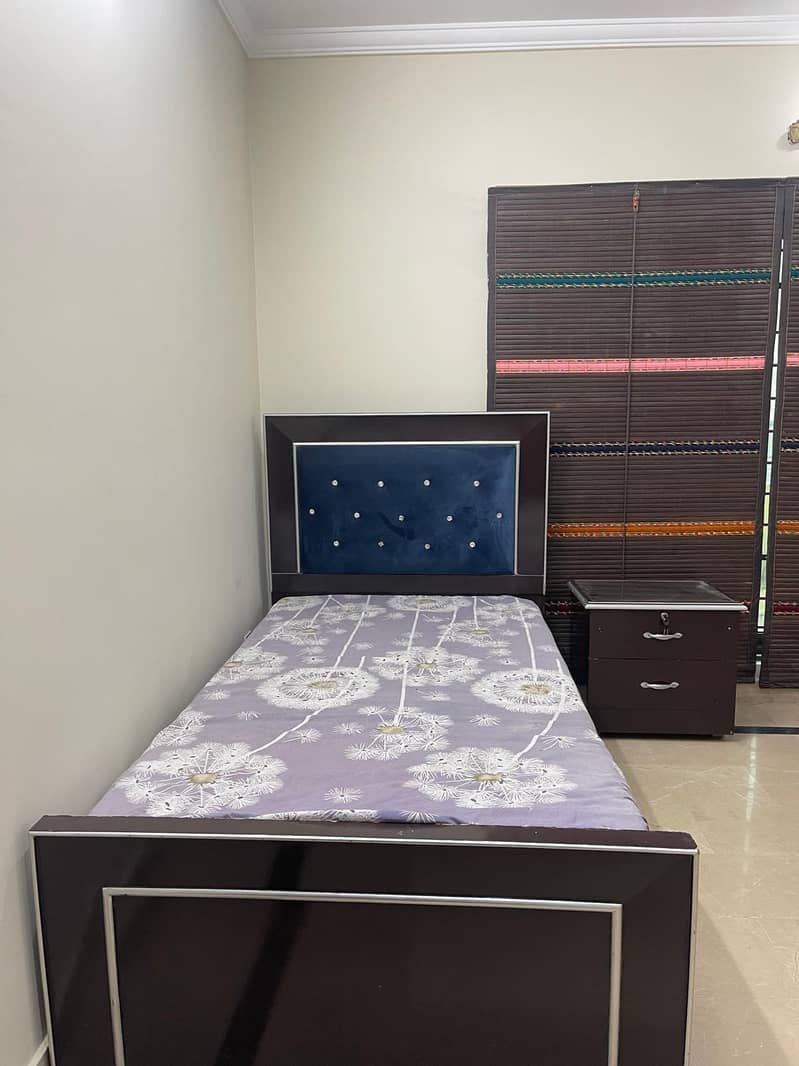 single bed with one side table 0