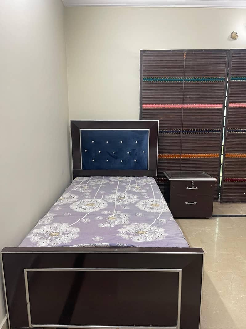 single bed with one side table 1