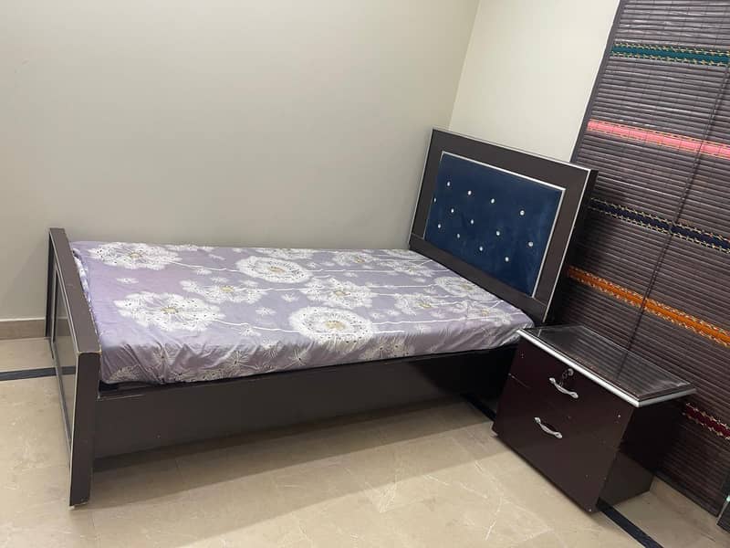 single bed with one side table 2