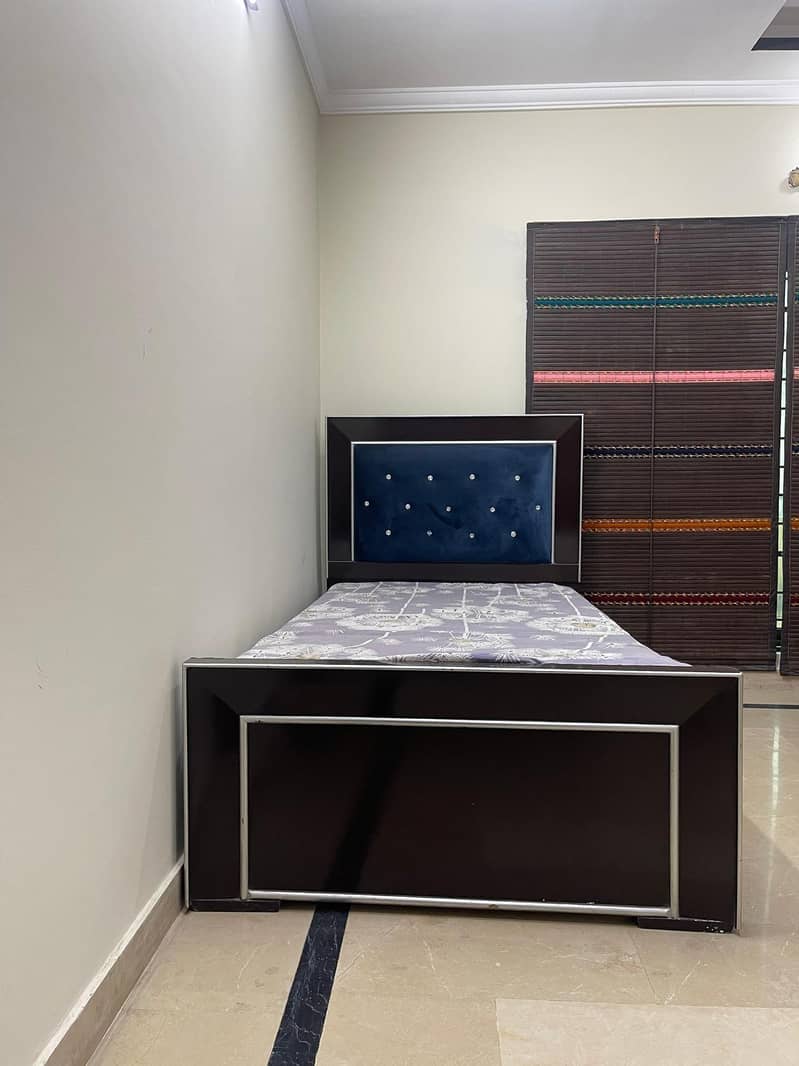 single bed with one side table 5